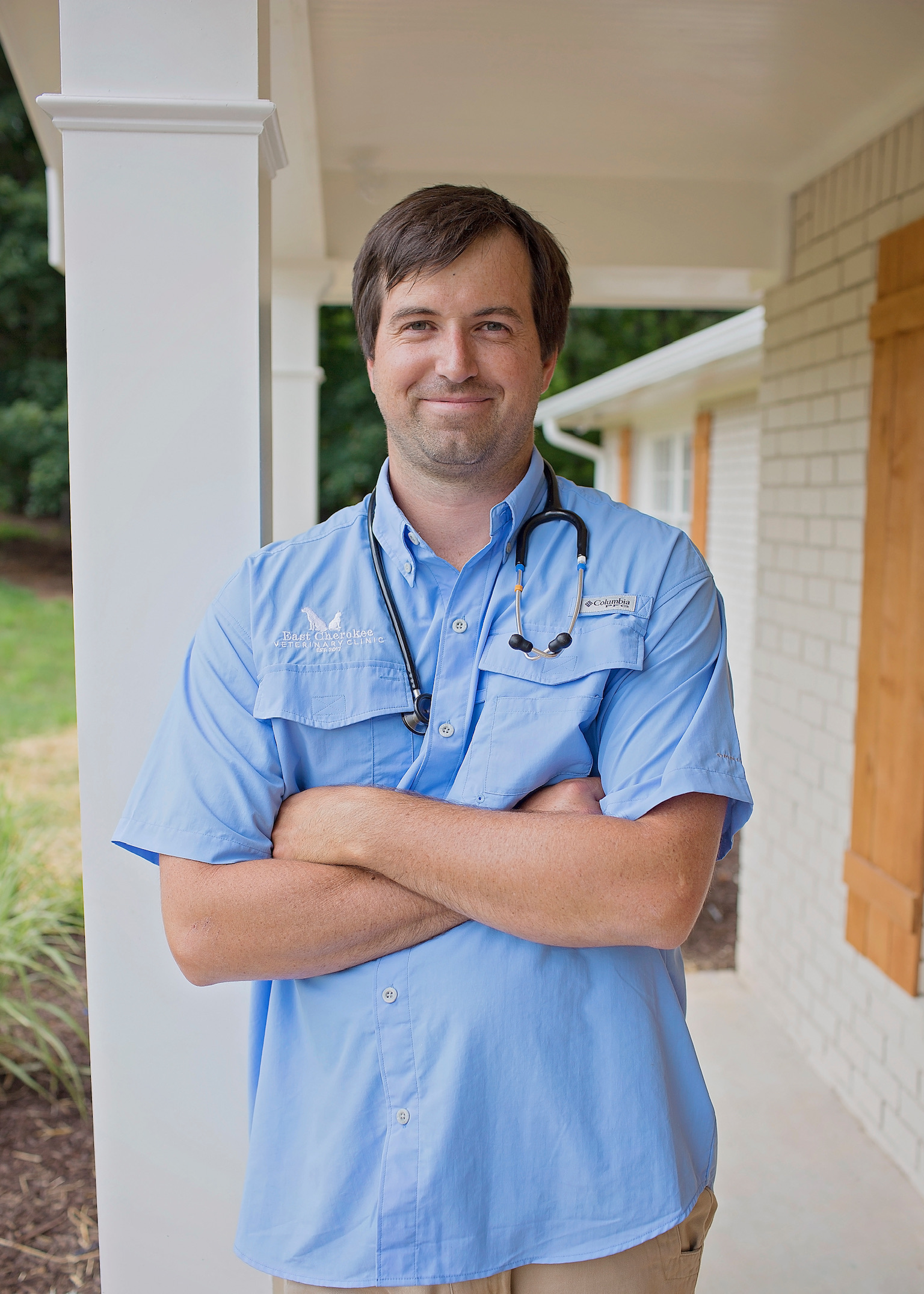 Dr Rob standing outside clinic with stethoscope in Woodstock GA